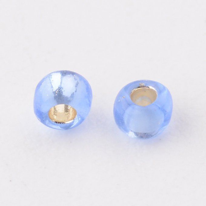 Rocaille ronde transparente  11/0  2.1x1.5mm trou argenté/ bleuet  (20g) 