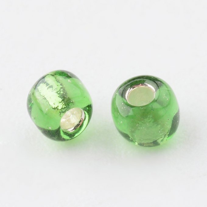 Rocaille transp  3mm,trou argenté,  vert (20g)