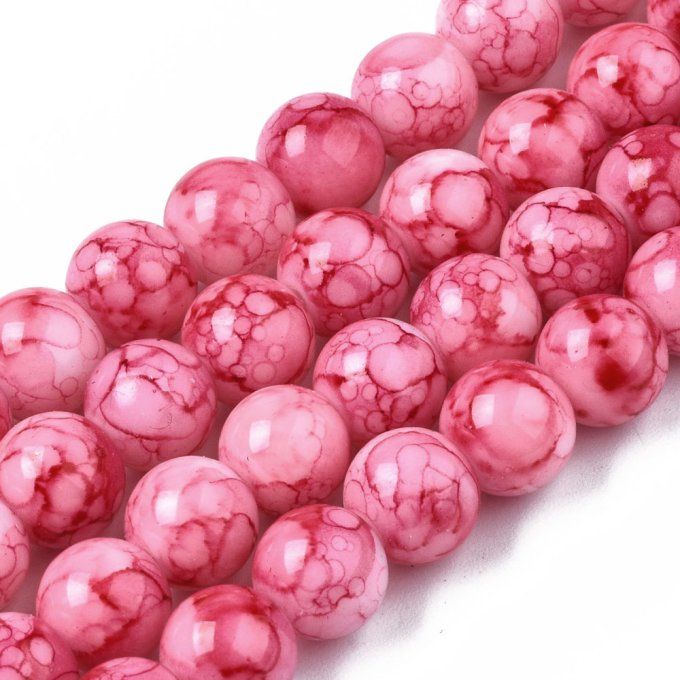 Perles en verre , rondes , colorées , 8-8.5 mm  motif sur fond rose (x10)