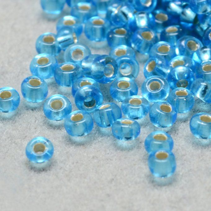 Rocaille ronde (grade a)  4x3mm transparente ,trou argenté,  couleur bleu ciel (20g) 